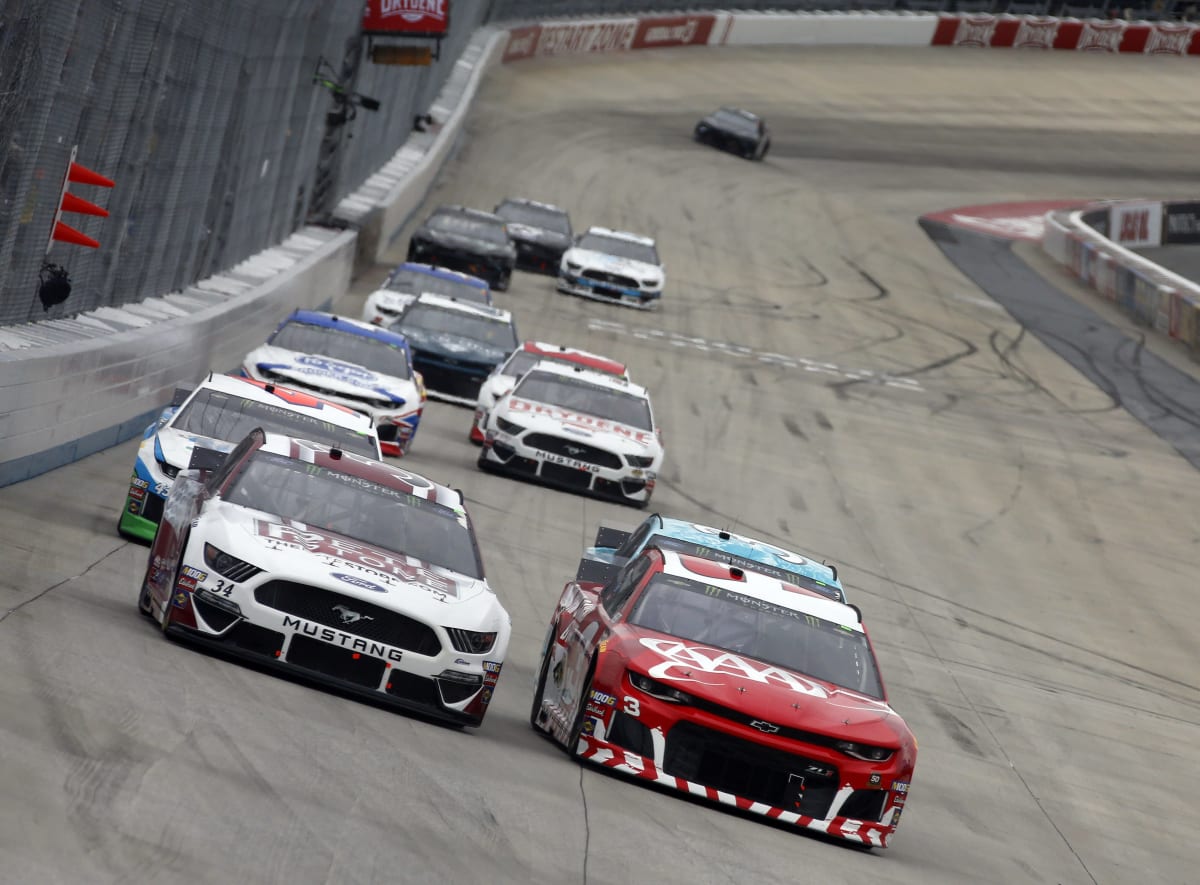 Austin Dillon drives the No. 3 AAA Chevrolet under a group of cars during Sunday's race at Dover.