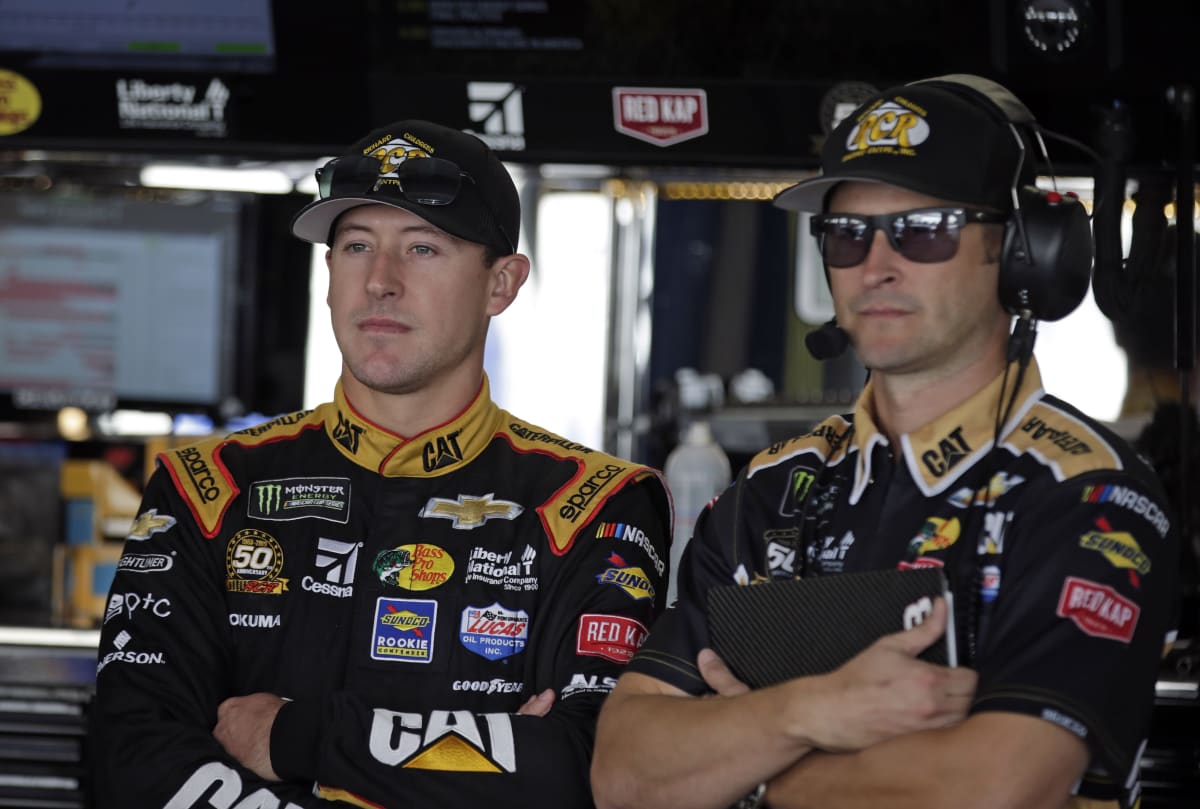 Daniel Hemric and crew chief Luke Lambert stand in the Cup Series garage waiting for the start of final practice at Dover.