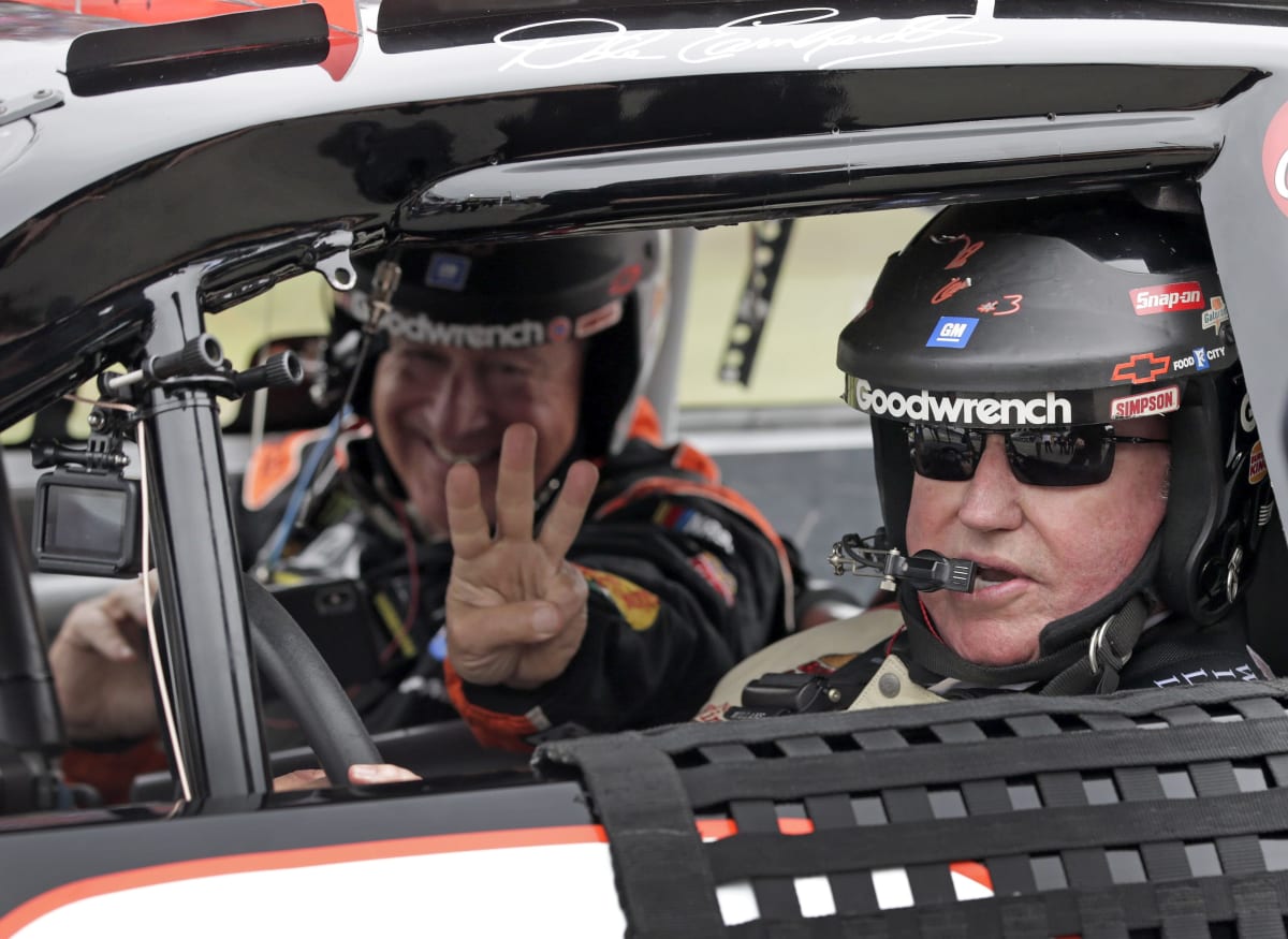 Bass Pro Shops' Johnny Morris flashes a No. 3 as Richard Childress prepares to take off for pace laps Sunday at Talladega Superspeedway.