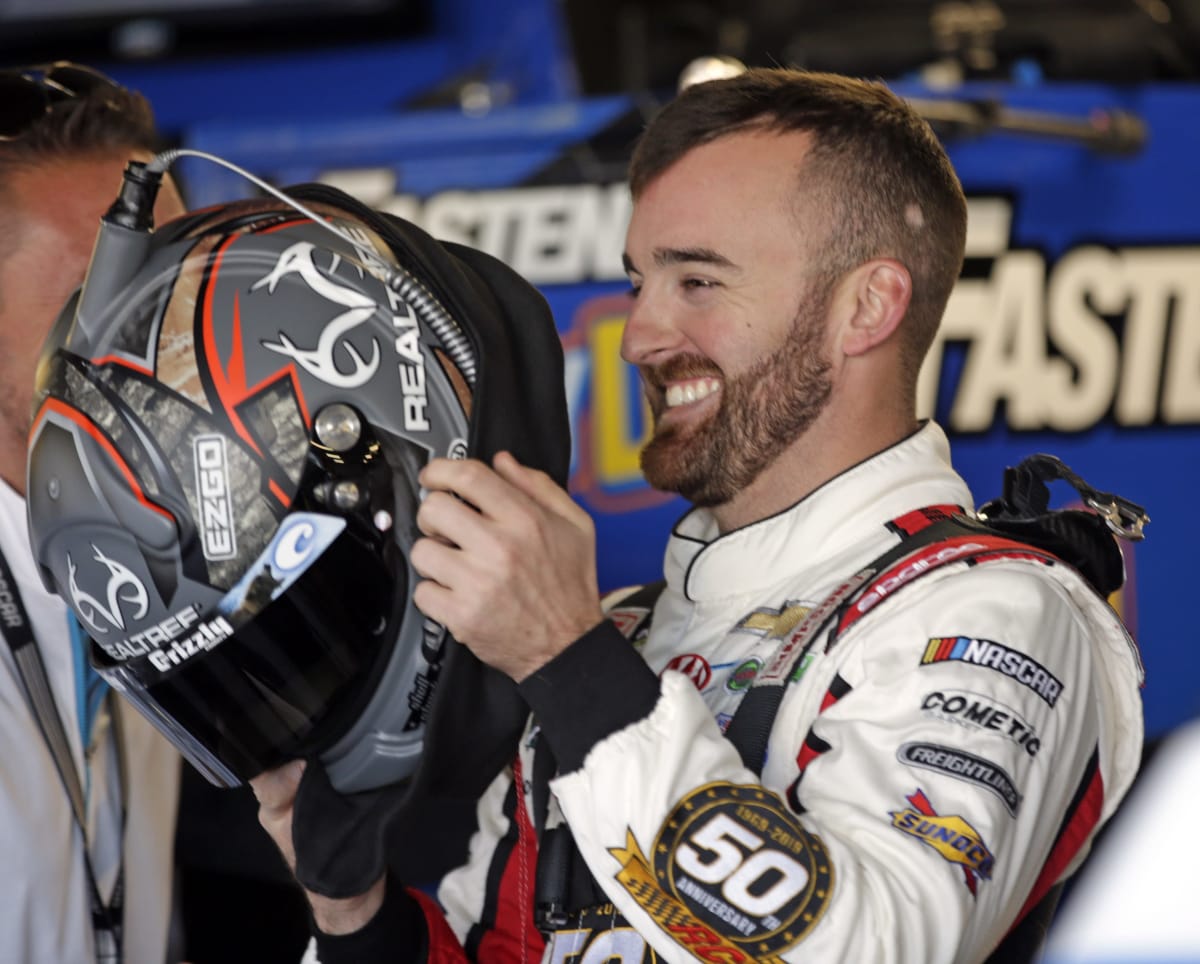 Austin Dillon prepares to climb in the No. 3 Roland Chevrolet for opening Cup Series practice at Kansas Speedway.