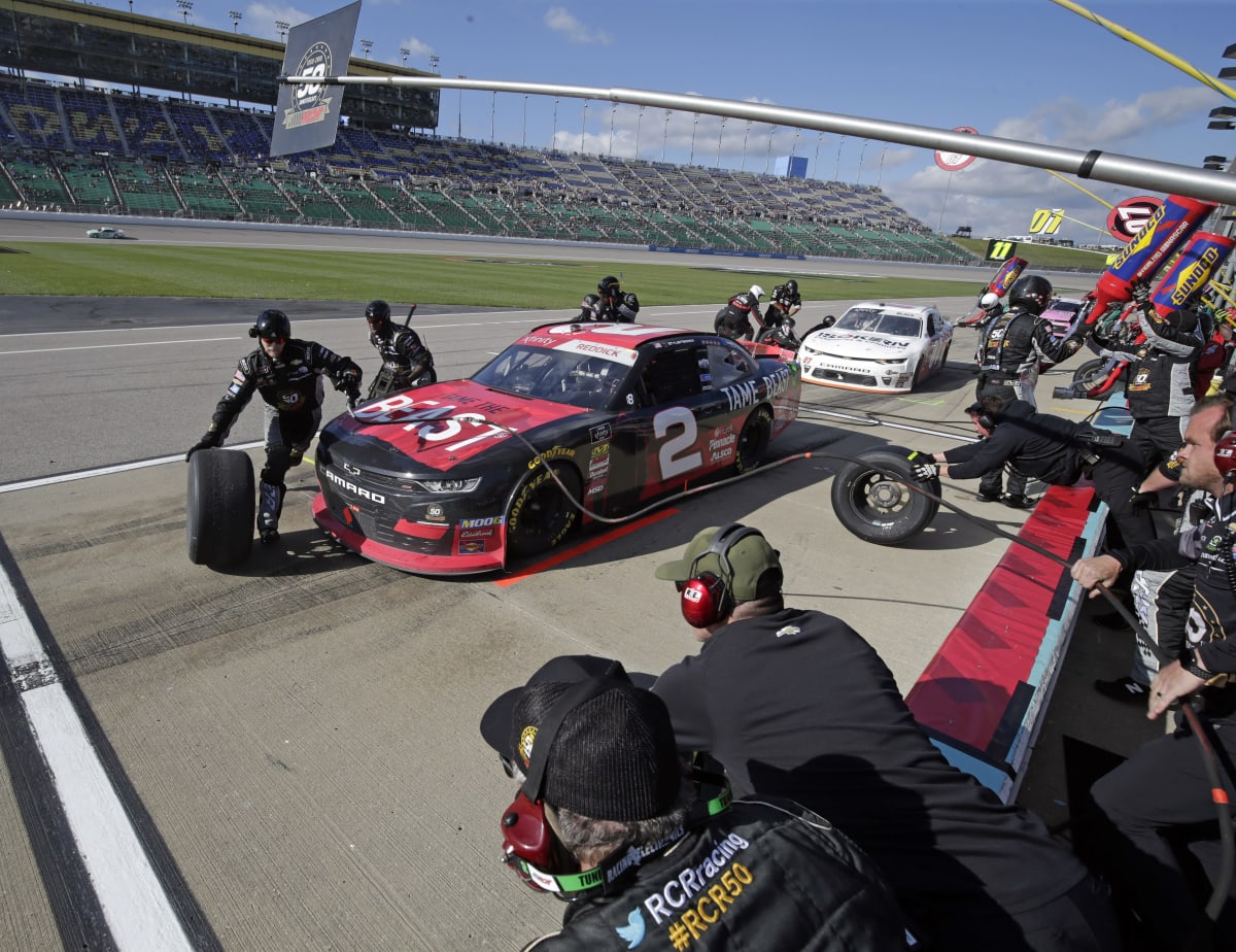 The No. 2 crew goes to work on Tyler Reddick's Tame the Beast Chevrolet during the stage break Saturday at Kansas Speedway.