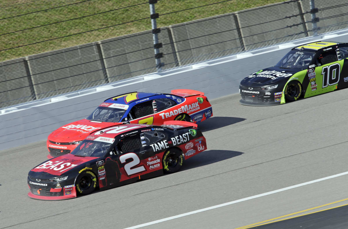 Tyler Reddick's No. 2 Tame the Beast Chevrolet races to the inside of Justin Allgaier during the opening stage of Saturday's NASCAR Xfinity Series race at Kansas Speedway.