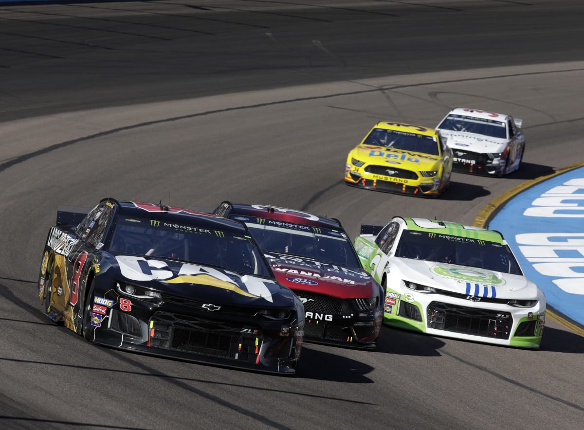 Daniel Hemric's No. 8 Cat Large Dozers Chevrolet and Austin Dillon's No. 3 American Ethanol Chevrolet race three-wide during the second stage of Sunday's race at ISM Raceway.