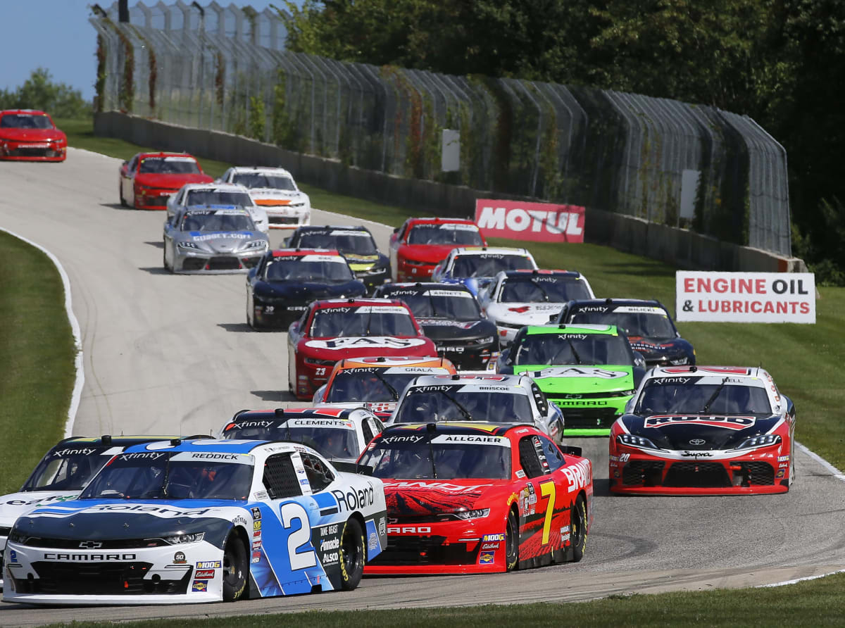 Tyler Reddick's No. 2 Roland Chevrolet leads the outside line on a restart as the field works through the sweeping right-hand corner during Saturday's race at Road America.
