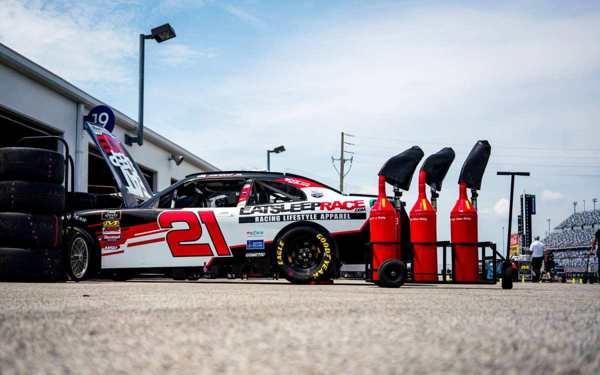 The No. 21 Eat Sleep Race team works hard to dial in Joe Graf Jr.&apos;s Camaro before Thursday&apos;s practice sessions.