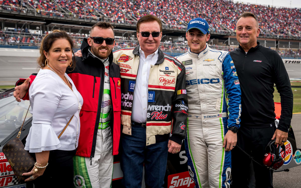 The Dillon family poses with patriarch Richard Childress before he climbs in Dale Earnhardt's No. 3 GM Goodwrench Chevrolet for pace laps prior to Sunday's race at Talladega Superspeedway.