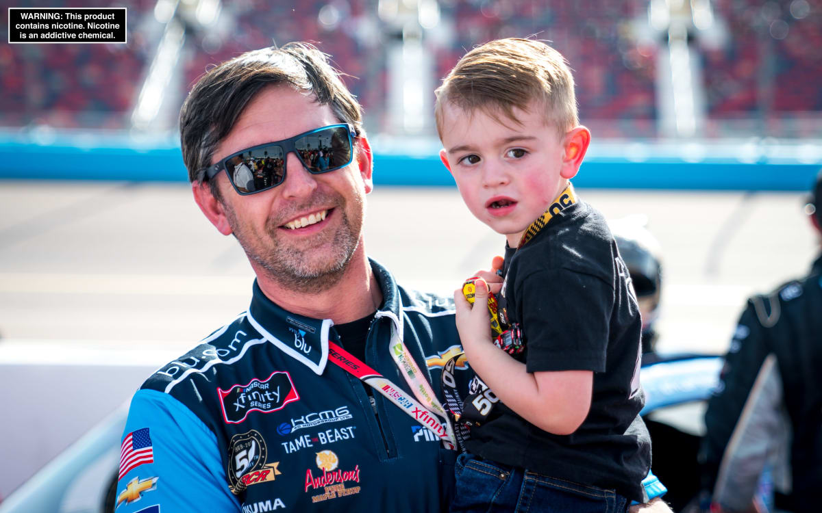 Crew chief Randall Burnett poses for a photo with his son on the grid prior to Saturday's NASCAR Xfinity Series race at ISM Raceway.