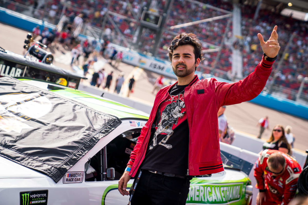 YouTube celebrity Hooman records a video in front of Austin Dillon's No. 3 American Ethanol Chevrolet before Sunday's race at ISM Raceway.