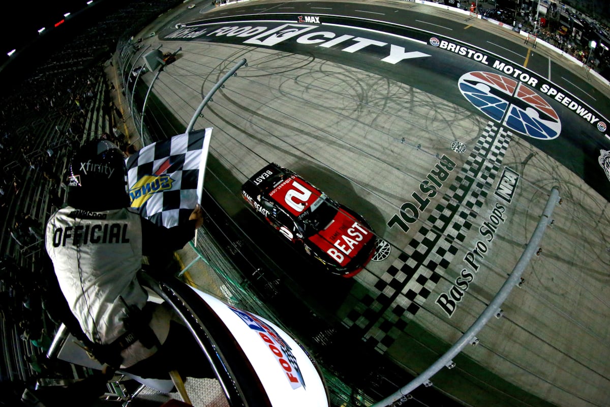 Tyler Reddick takes the checkered flag after a hard-fought victory during Friday night's NASCAR Xfinity Series race at Bristol Motor Speedway.