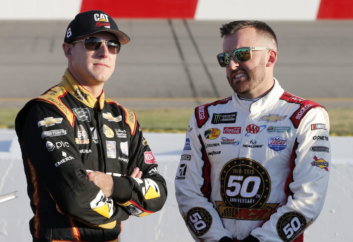 Daniel Hemric and Austin Dillon stand on pit road during Cup Series qualifying Friday at Richmond Raceway.
