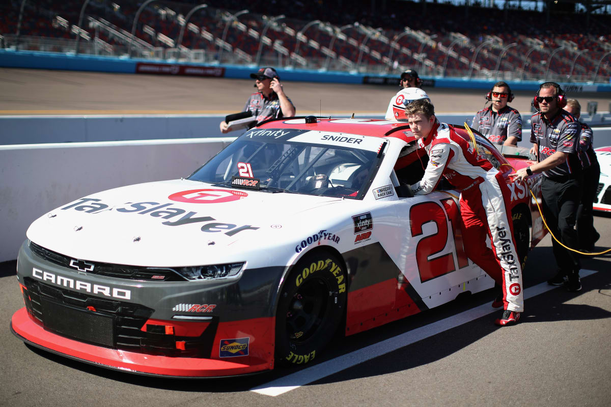 AVONDALE, ARIZONA - MARCH 07: Myatt Snider, driver of the #21 TaxSlayer Chevrolet, helps push his car down the grid during qualifying for the NASCAR Xfinity Series LS Tractor 200 at Phoenix Raceway on March 07, 2020 in Avondale, Arizona. (Photo by Christian Petersen/Getty Images) | Getty Images