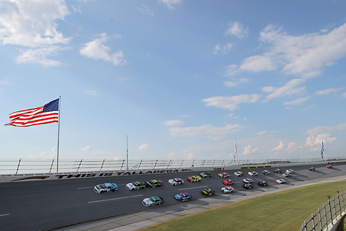 TALLADEGA, ALABAMA - JUNE 20: Anthony Alfredo, driver of the #21 DUDE Wipes Chevrolet, and Austin Cindric, driver of the #22 MoneyLion Ford, lead a pack of cars during the NASCAR Xfinity Series Unhinged 300 at Talladega Superspeedway on June 20, 2020 in Talladega, Alabama. (Photo by Chris Graythen/Getty Images) | Getty Images
