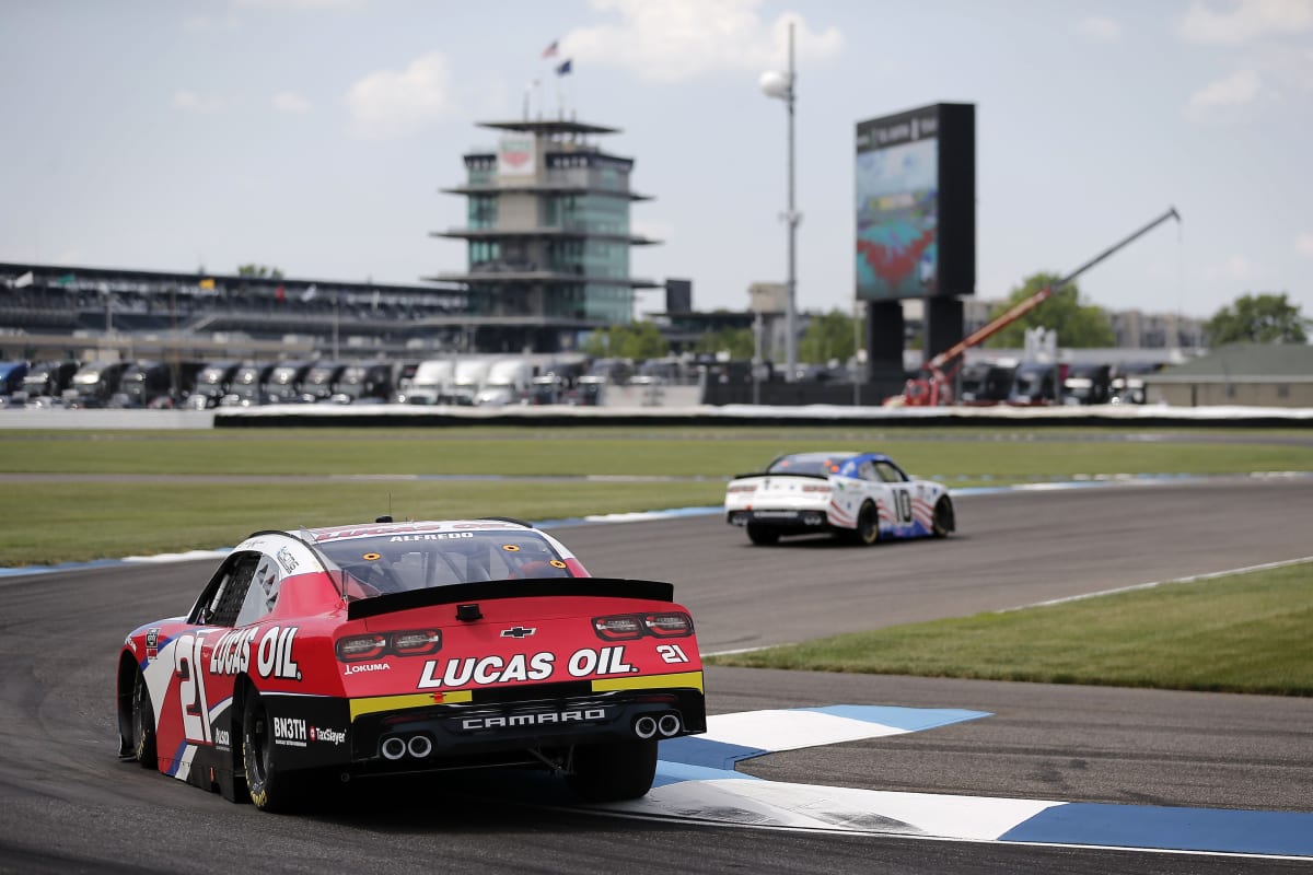 INDIANAPOLIS, INDIANA - JULY 03:  Ross Chastain, driver of the #10 Chevy Accessories Chevrolet, leads Anthony Alfredo, driver of the #21 Lucas Oil Chevrolet, during practice for the NASCAR Xfinity Series Pennzoil 150 at the Brickyard at Indianapolis Motor Speedway on July 03, 2020 in Indianapolis, Indiana. (Photo by Jamie Squire/Getty Images) | Getty Images