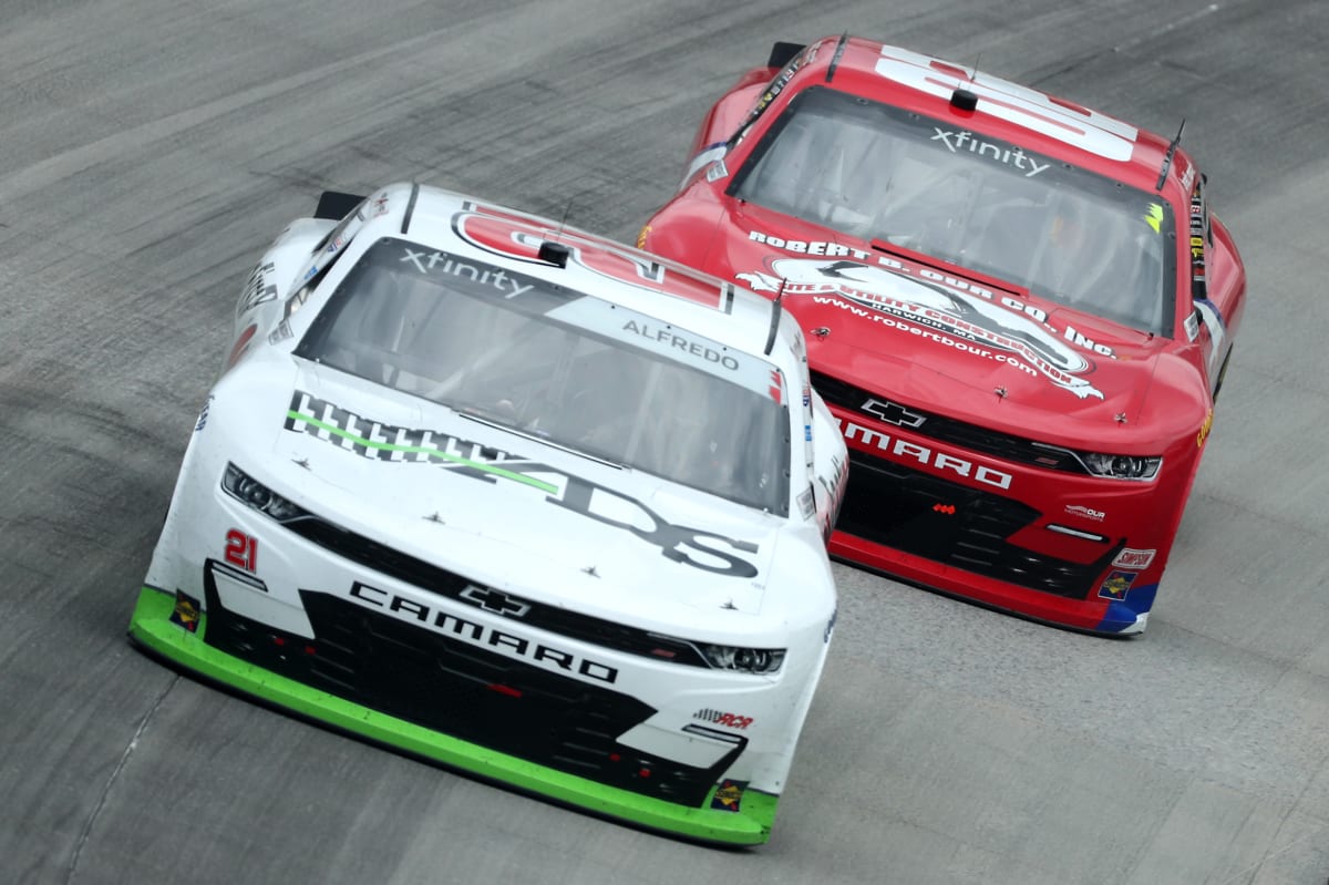DOVER, DELAWARE - AUGUST 22: Anthony Alfredo, driver of the #21 ADS/Footing First Chevrolet, and Brett Moffitt, driver of the #02 Robert B Our Inc Chevrolet, race during the NASCAR Xfinity Series Drydene 200 at Dover International Speedway on August 22, 2020 in Dover, Delaware. (Photo by Hunter Martin/Getty Images) | Getty Images