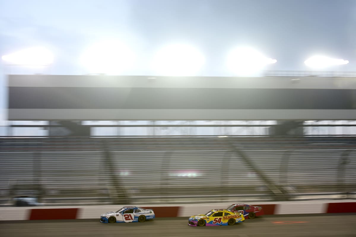 RICHMOND, VIRGINIA - SEPTEMBER 11: Kaz Grala, driver of the #21 ruedebusch.com Chevrolet, and Kyle Busch, driver of the #54 Starburst Duos Toyota, race during the NASCAR Xfinity Series Go Bowling 250 at Richmond Raceway on September 11, 2020 in Richmond, Virginia. (Photo by Jared C. Tilton/Getty Images) | Getty Images