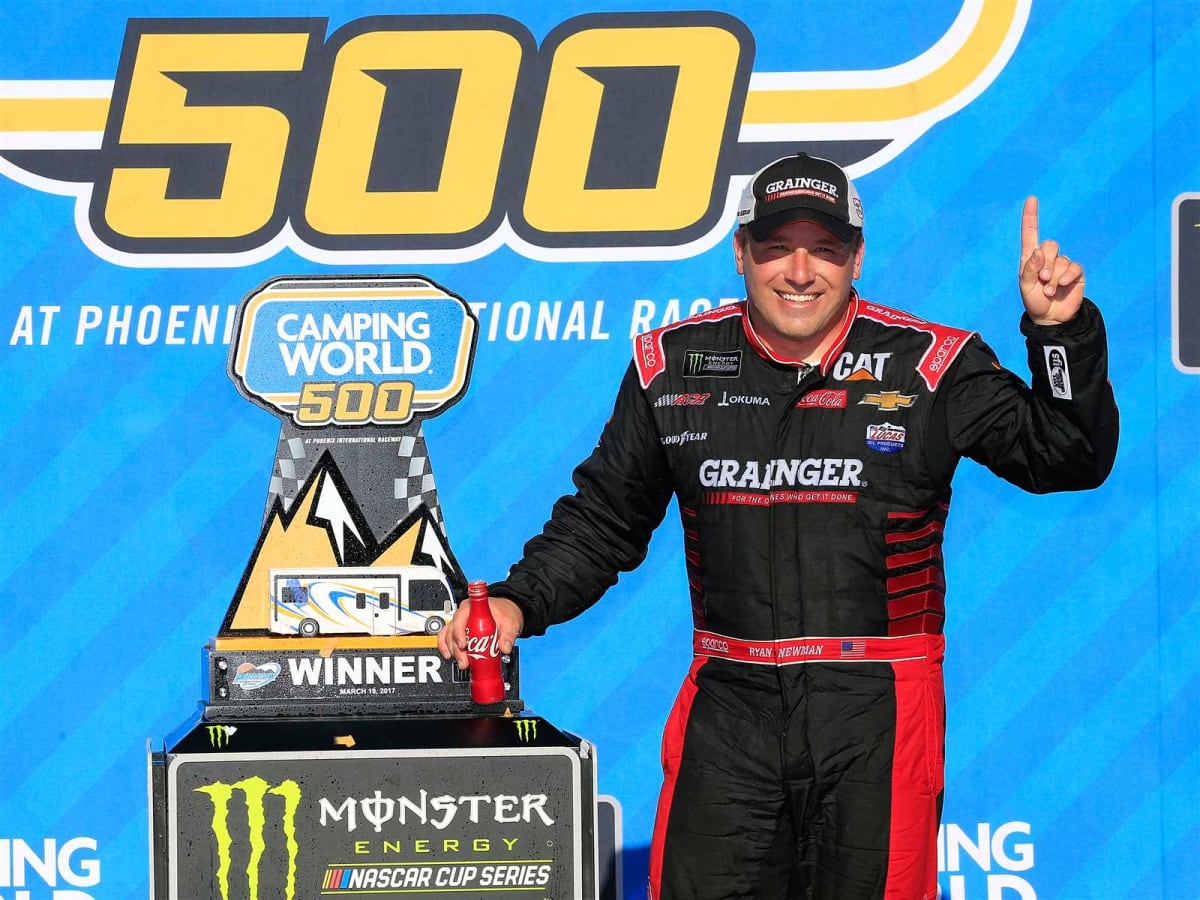 Ryan Newman poses with the trophy after winning at Phoenix Raceway in the No. 31 Grainger Chevrolet.