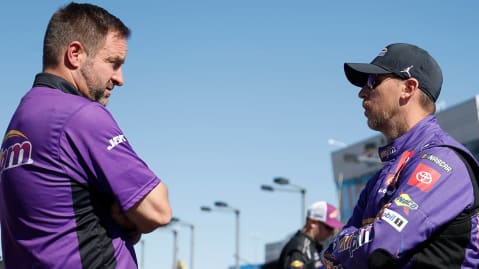 Denny Hamlin, right, speaks with No. 11 crew chief Chris Gayle on the pit road at Las Vegas Motor Speedway