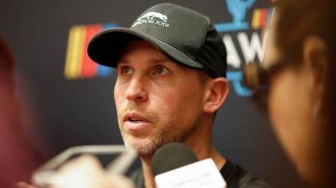 Denny Hamlin speaks to media before the NASCAR Awards banquet in Scottsdale, Ariz.