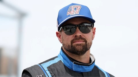 Ricky Stenhouse Jr. looks on.