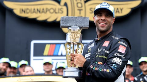 Bubba Wallace celebrates a 2025 NASCAR Cup Series win at the Brickyard.