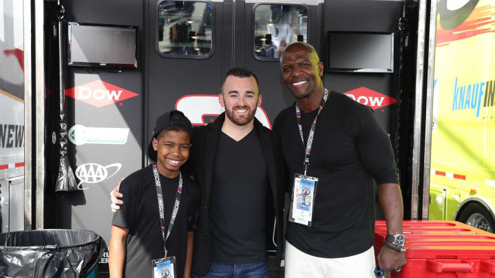 Austin Dillon poses for a photo with actor Terry Crews and his son.