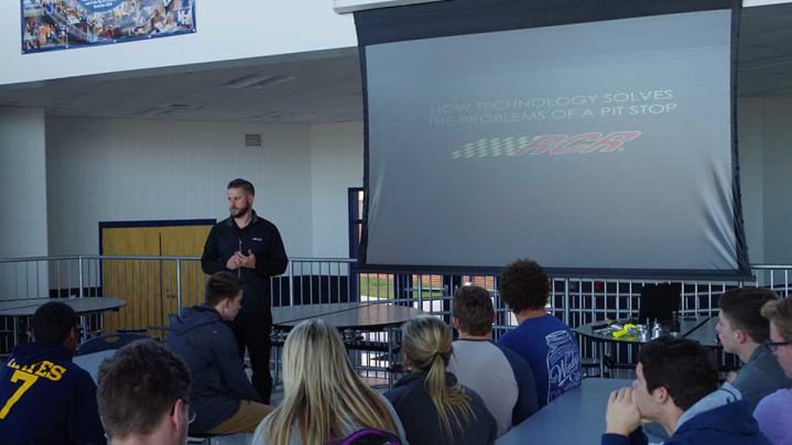 As part of the RCR STEM program, Future Drivers, crew chief Luke Lambert engages Mount Airy H.S. students in real-world learning experiences in engineering, manufacturing, quality control and analytics.