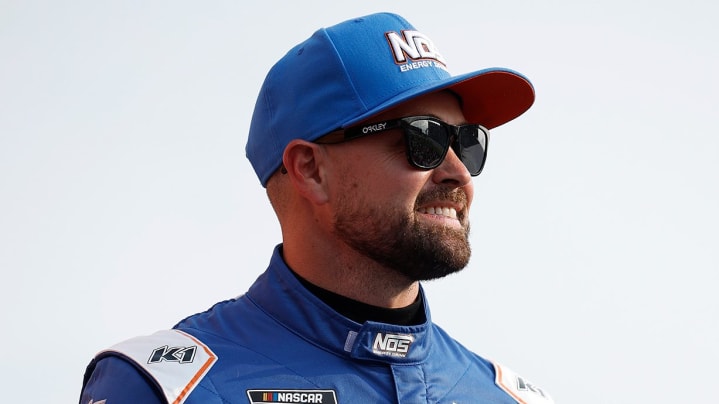 Ricky Stenhouse Jr. looks on.