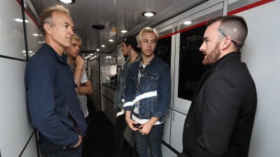 Austin Dillon give a hauler tour to members of the band R5.