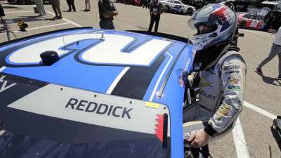 Tyler Reddick hopping in his No. 2 KC Motorgroup Chevrolet Camaro moments before his practice laps at Michigan International Speedway.