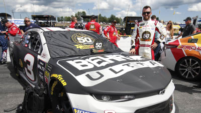 Austin Dillon strikes a pose next to his BEHR ULTRA Chevrolet Camaro ZL1.