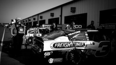 The No. 3 Freightliner Camaro ZL1 heads into the garage for some adjustments in between practice runs.