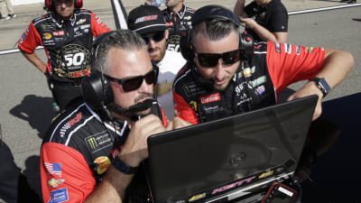 Crew chief Danny Stockman, race engineer Ryan Sparks and Austin Dillon look at the scoring monitor during qualifying at Michigan International Speedway. (HHP/Alan Marler)