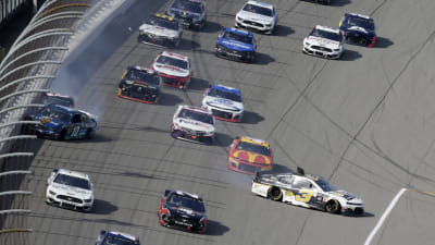Austin Dillon gets spun and Daniel Hemric is pinned against the wall after Aric Almirola moved up the track into the two RCR cars at the conclusion of Stage 2 at Michigan International Speedway.
