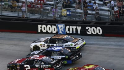 Tyler Reddick makes an aggressive move on the bottom of a three-wide situation early in the race. Reddick had to start in the rear and make a pass-through penalty at the start of the race.