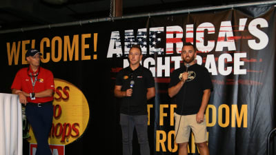 Austin Dillon and Daniel Hemric speak to a group of guests from Bass Pro Shops prior to Saturday night's driver/crew chief meeting.