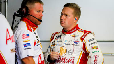 Tyler Reddick talks with car chief Cam Strader between practice runs Friday at Indianapolis Motor Speedway. (HHP/Barry Cantrell)