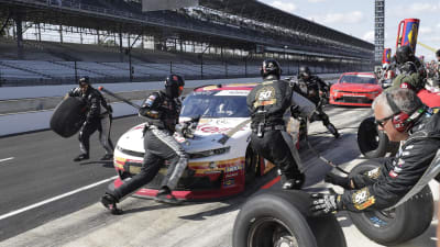 The No. 2 pit crew race around to the left side of Tyler Reddick's No. 2 Anderson's Maple Syrup Chevrolet during Saturday's NASCAR Xfinity Series race at Indianapolis Motor Speedway. (HHP/Harold Hinson)