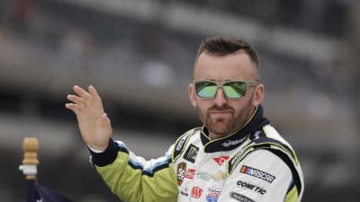 Austin Dillon rides in the back of a truck saluting the fans prior to the running of Sunday's Brickyard 400 at Indianapolis Motor Speedway. (HHP/Harold Hinson)