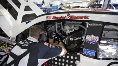 Daniel Hemric debriefs with a team member in between practice runs on Friday.