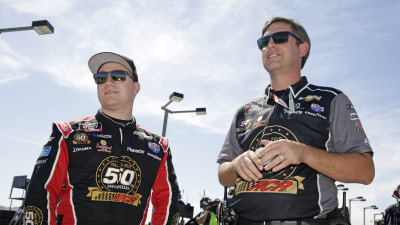 Tyler Reddick and crew chief Randall Burnett watch as qualifying rolls on at Las Vegas Motor Speedway.