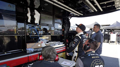 Tyler Reddick looks over the scoring data between practice runs Friday at Richmond Raceway.