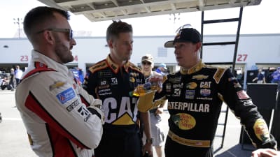 Daniel Hemric and crew chief Luke Lambert check in with teammate Austin Dillon between Cup Series practice sessions at Richmond Raceway.