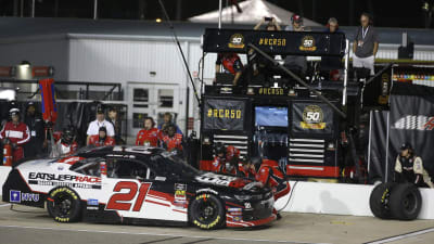 The RCR pit crew works on the left side of Joe Graf Jr.'s No. 21 Eat Sleep Race Chevrolet during Friday's NASCAR Xfinity Series race at Richmond Raceway.