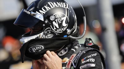 Austin Dillon straps on his Jack Daniel's helmet before climbing in the No. 3 Chevrolet for qualifying.