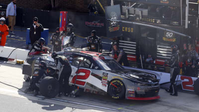 The No. 2 team works to make repairs to the right rear of Tyler Reddick's Freightliner Chevrolet after making contact with the wall on the opening lap of Saturday's race at Dover.