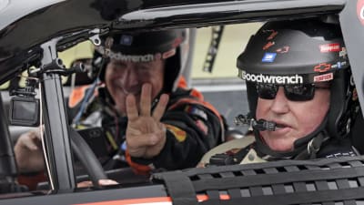 Bass Pro Shops' Johnny Morris flashes a No. 3 as Richard Childress prepares to take off for pace laps Sunday at Talladega Superspeedway.