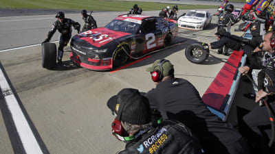 The No. 2 crew goes to work on Tyler Reddick's Tame the Beast Chevrolet during the stage break Saturday at Kansas Speedway.