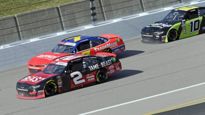 Tyler Reddick's No. 2 Tame the Beast Chevrolet races to the inside of Justin Allgaier during the opening stage of Saturday's NASCAR Xfinity Series race at Kansas Speedway.