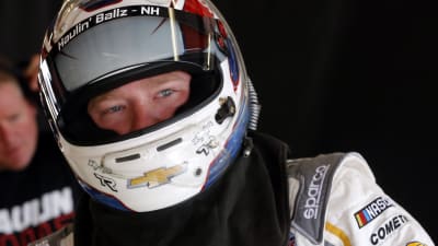 Tyler Reddick hops into his No. 2 American Ethanol / Novozymes Chevrolet before opening practice at Iowa Speedway.