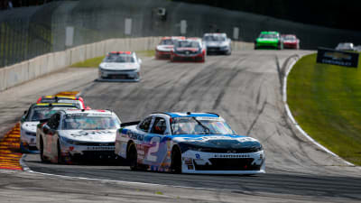 Tyler Reddick's No. 2 Roland Chevrolet leads a pack of cars into a tight left-hand turn during Saturday's race at Road America.